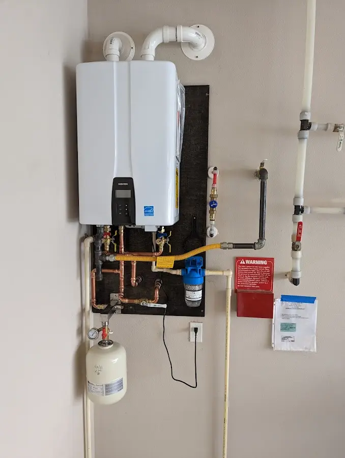 Professional plumber installing copper piping in a Haddonfield home